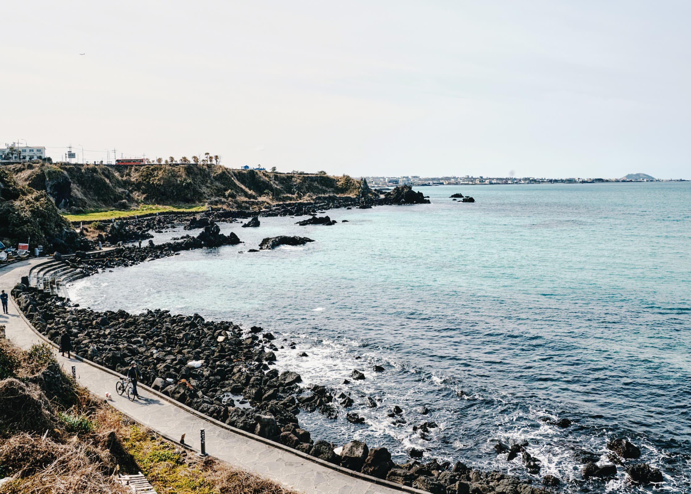 Basalt-lined coastal walking path along Jeju Olle Route 15-B