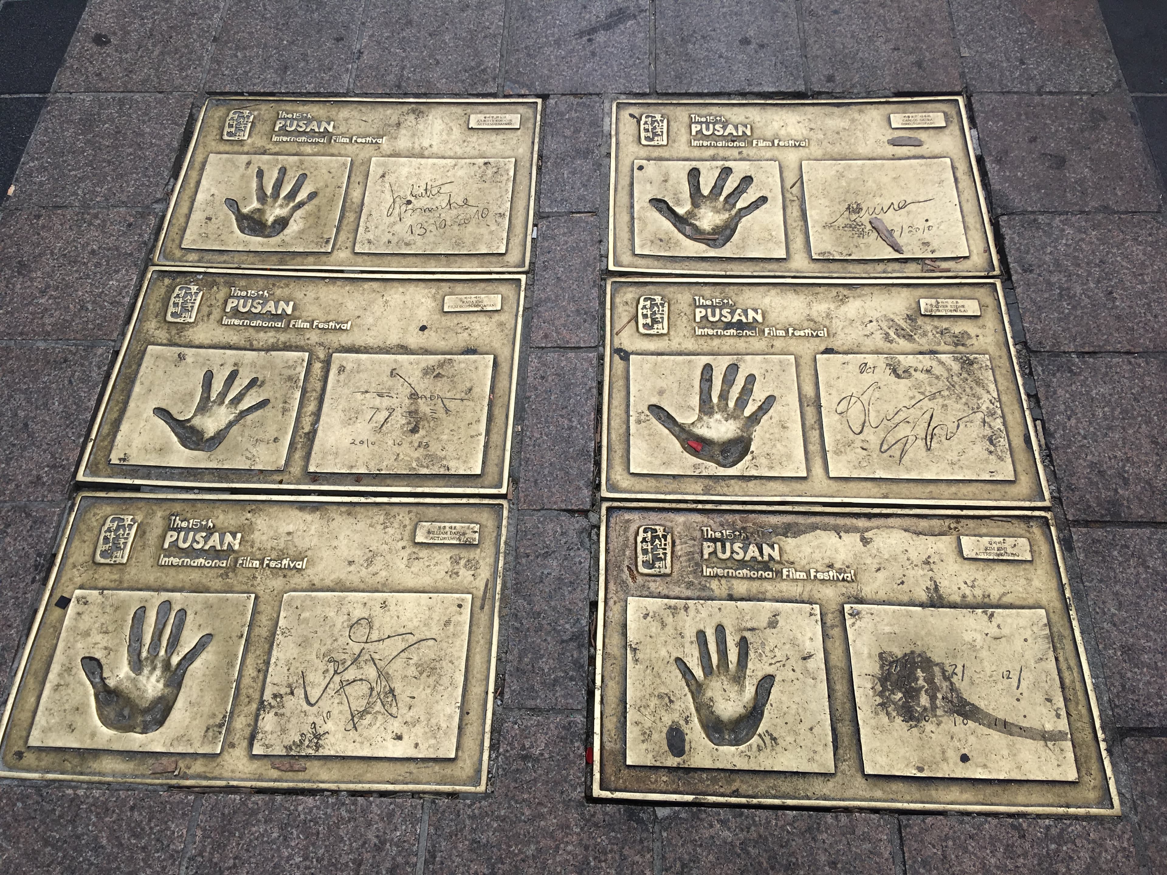 Hand-print plaques of film festival guests set into the pavement of BIFF Square