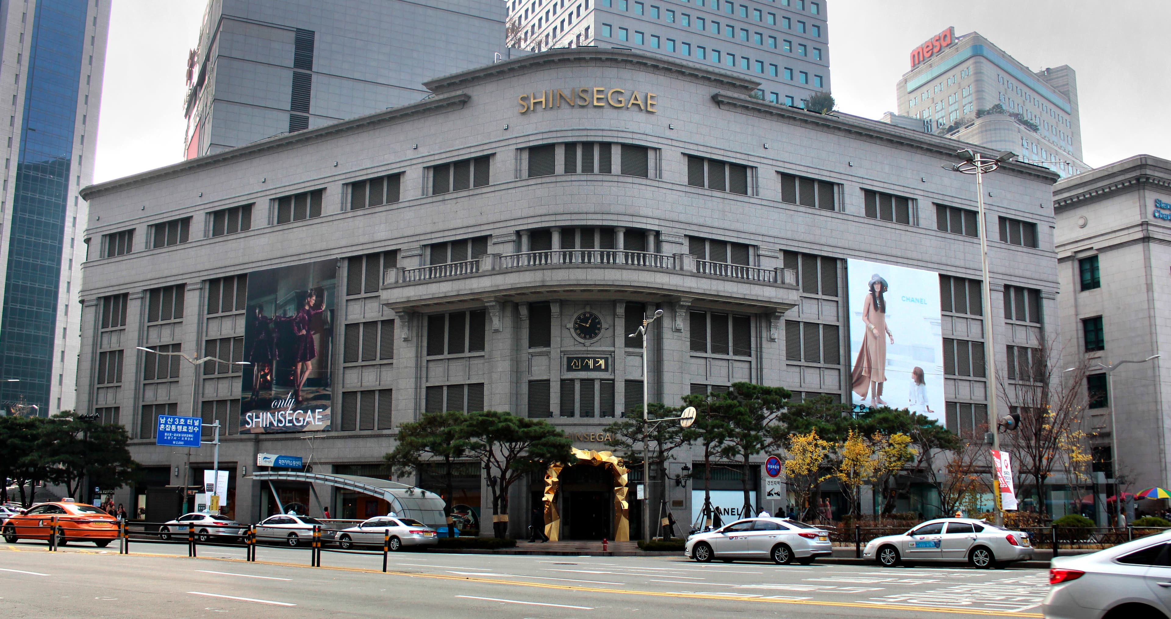 The Shinsegae Department Store main branch facade, with its signage overhead