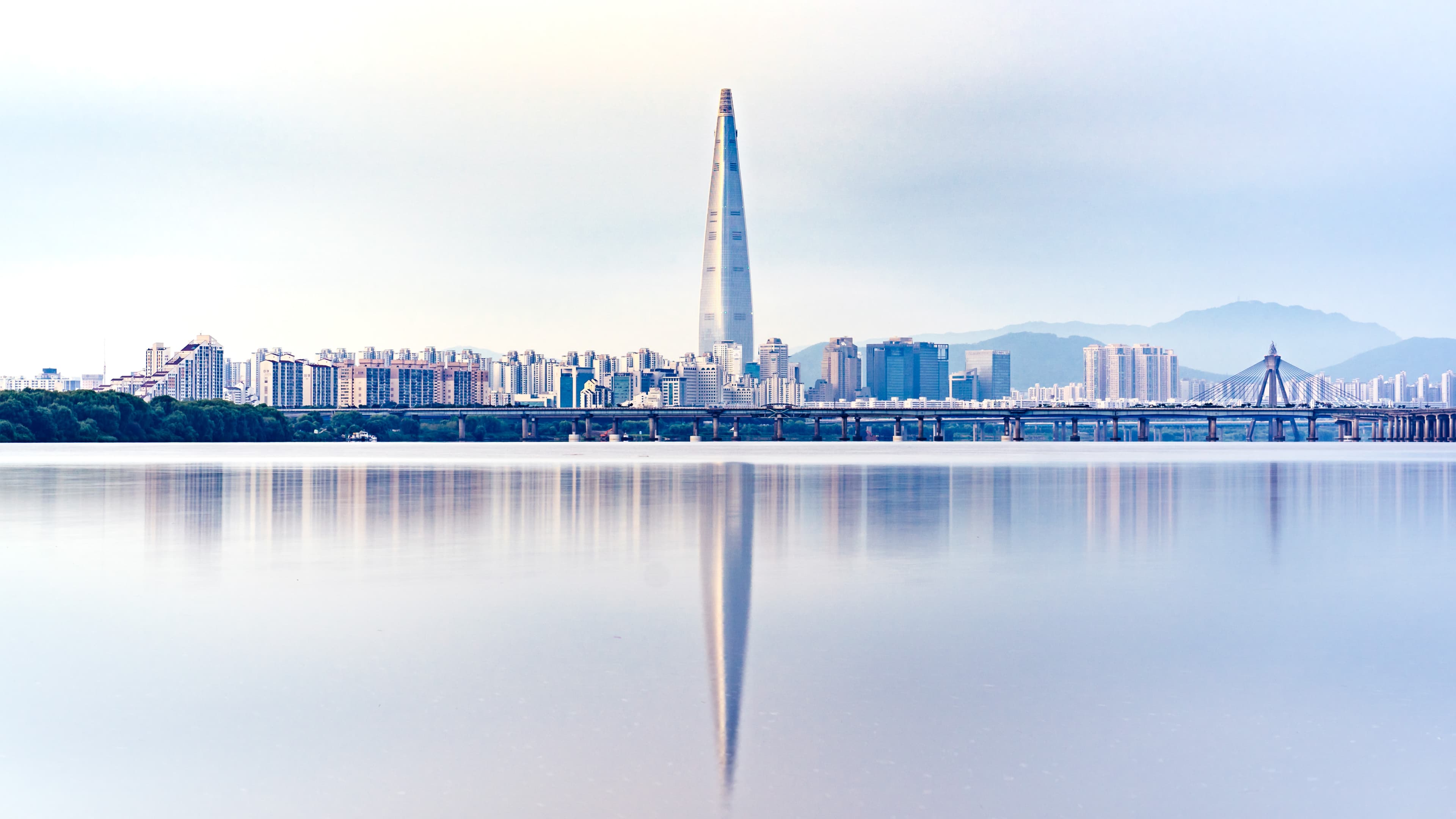 Lotte World Tower, home of the Seoul Sky observatory, reflected in the Han River
