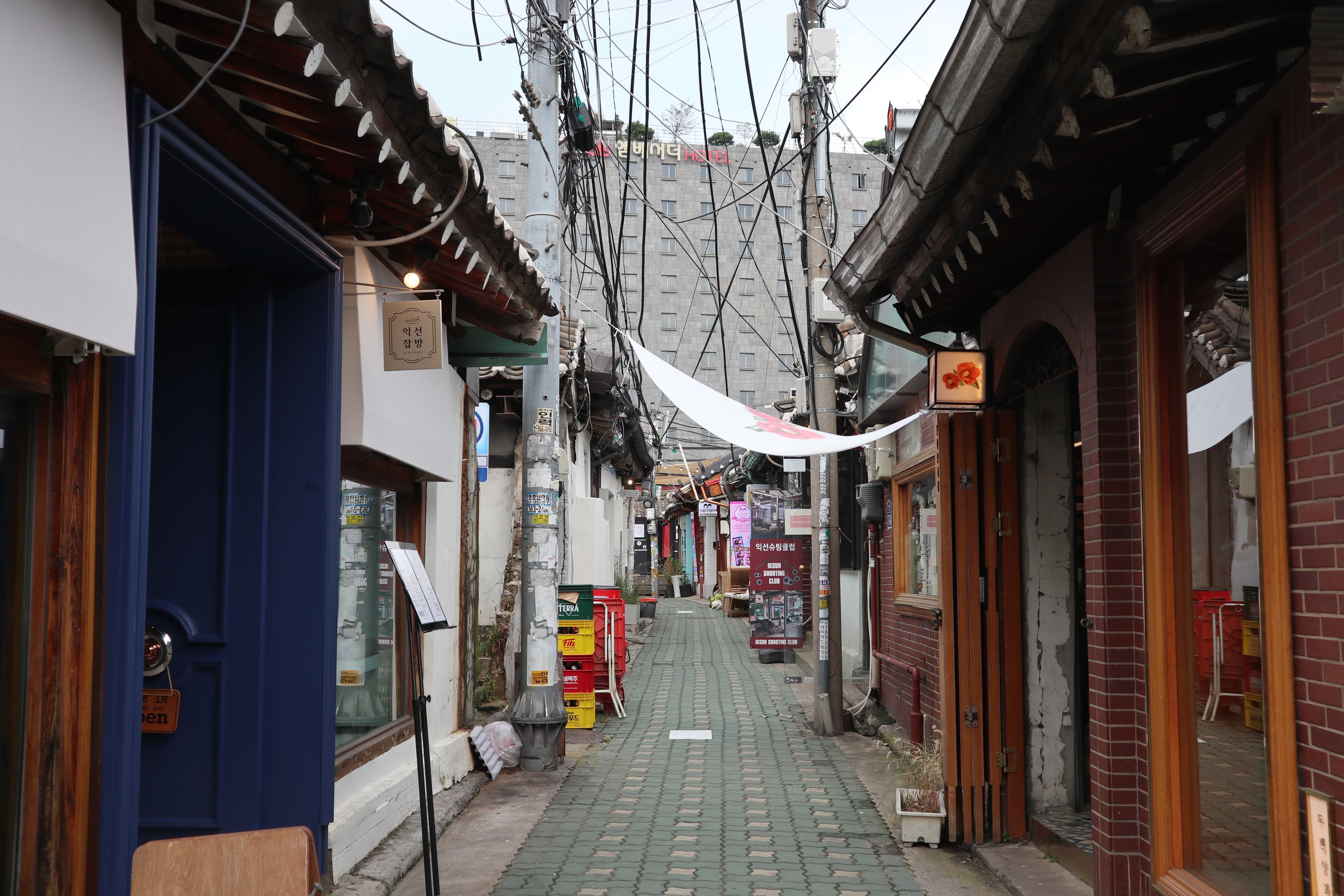 A narrow hanok alley in Ikseondong lined with cafes and small shops