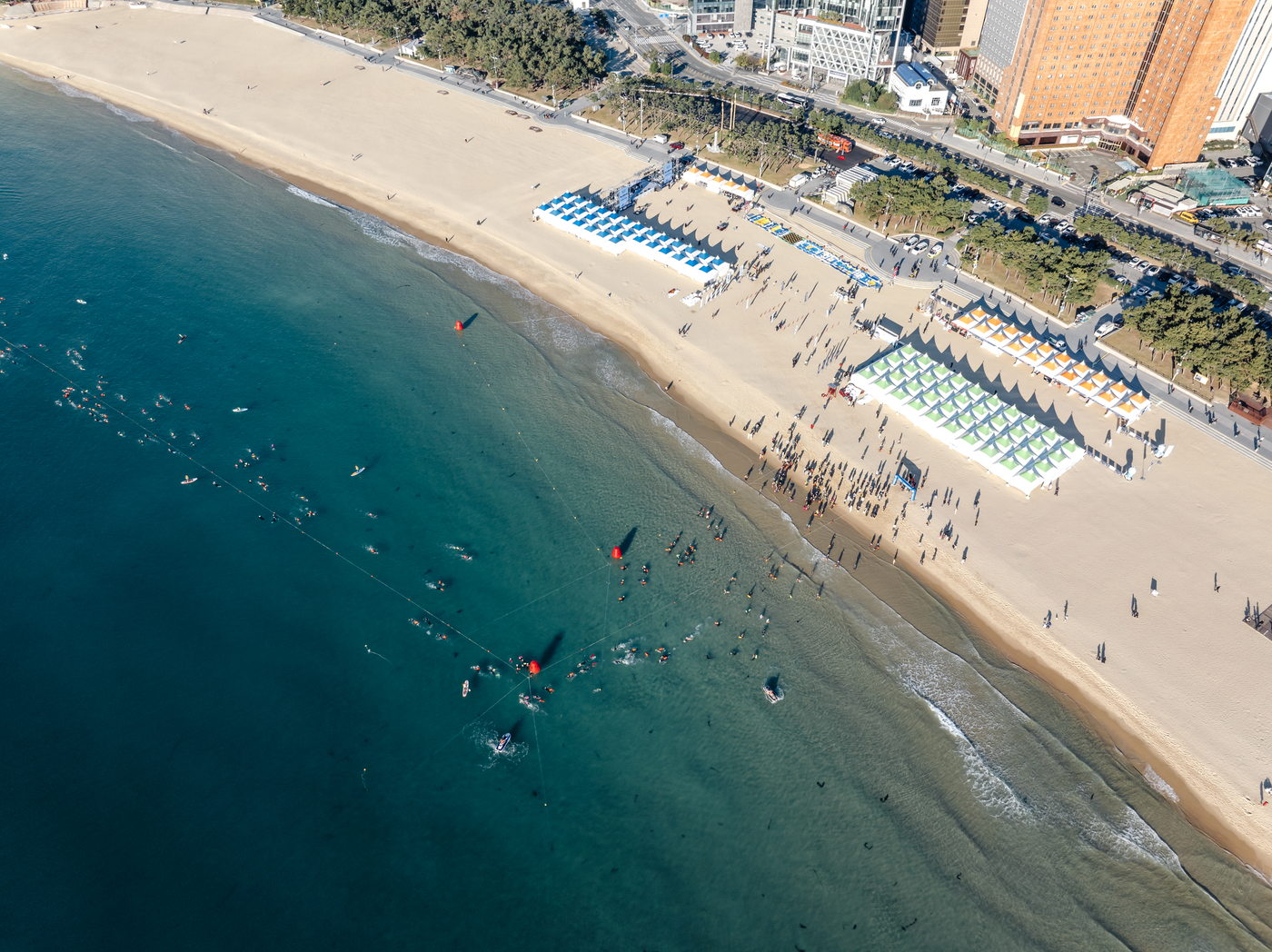 Aerial view of Haeundae Beach, its shoreline, and the waterfront promenade