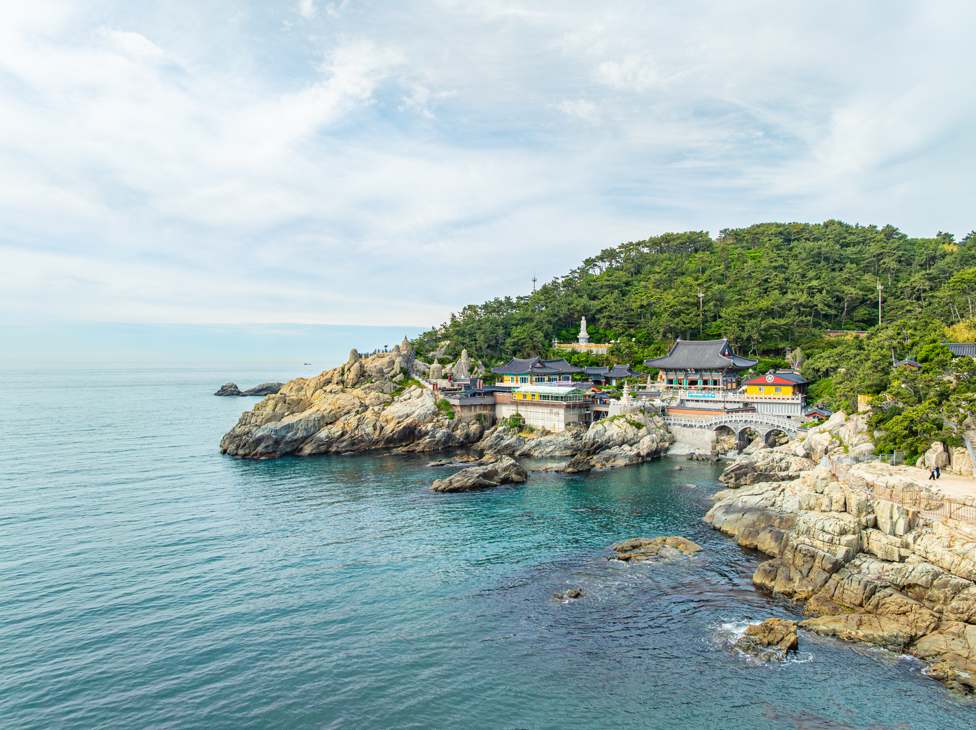 Haedong Yonggungsa temple buildings on the rocky coast beside the sea